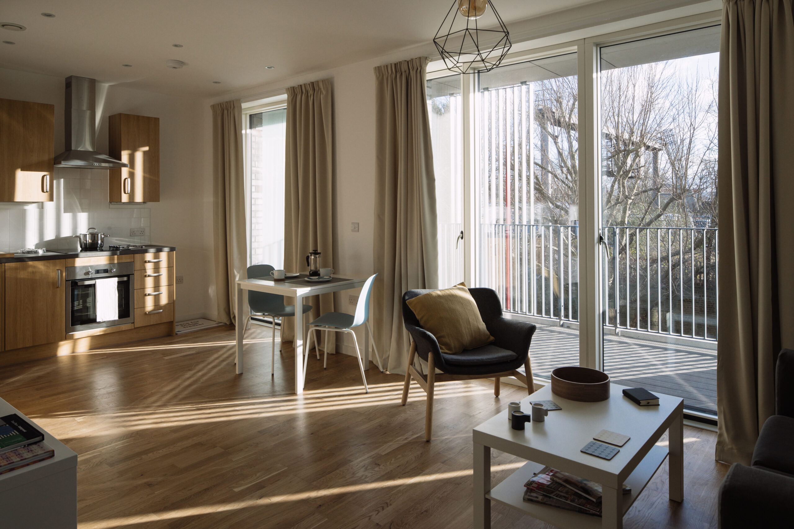 Interior shot showing the open plan kitchen and living room at Agar Grove