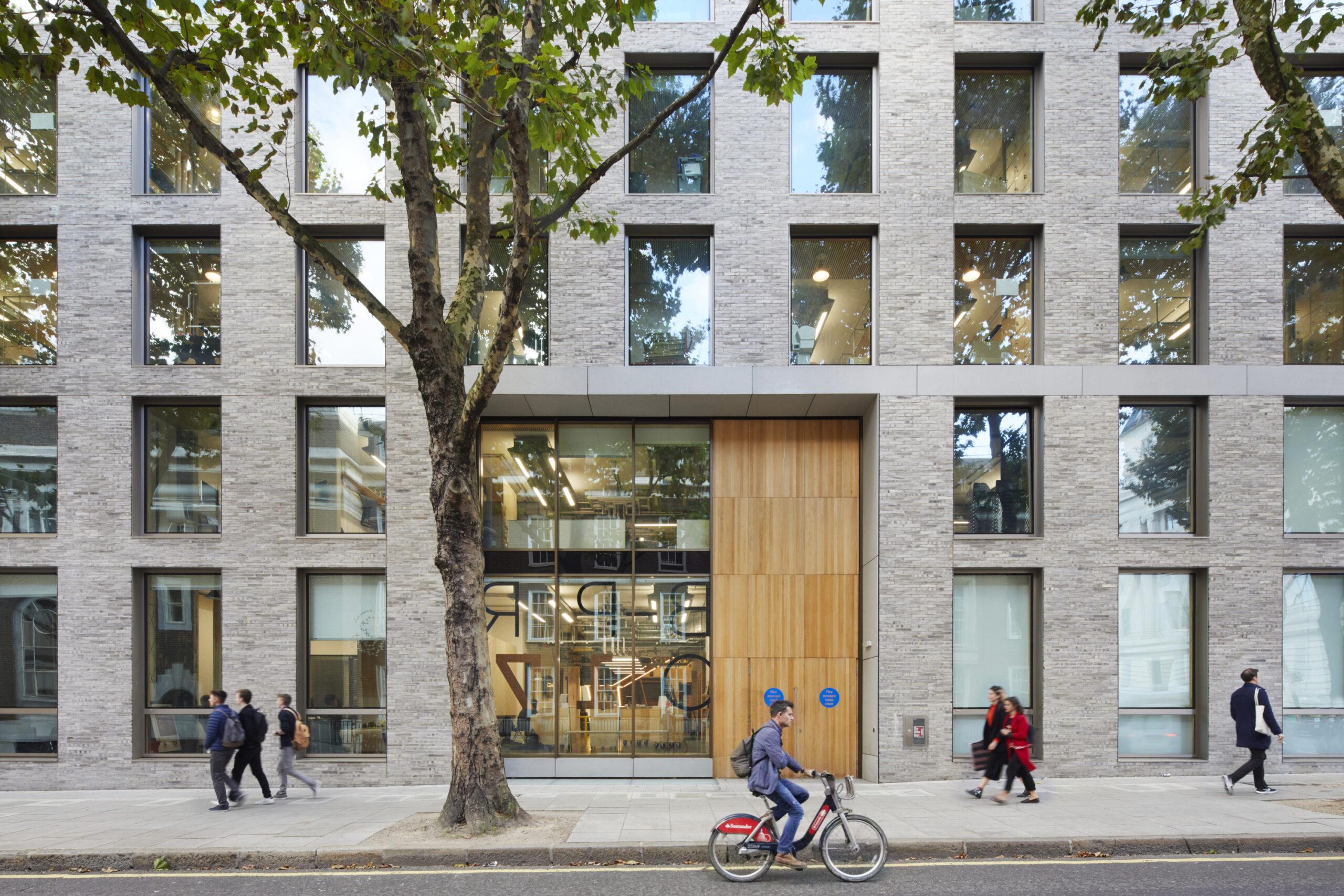 Exterior view of 22 Gordon Street with pedestrians and cyclist