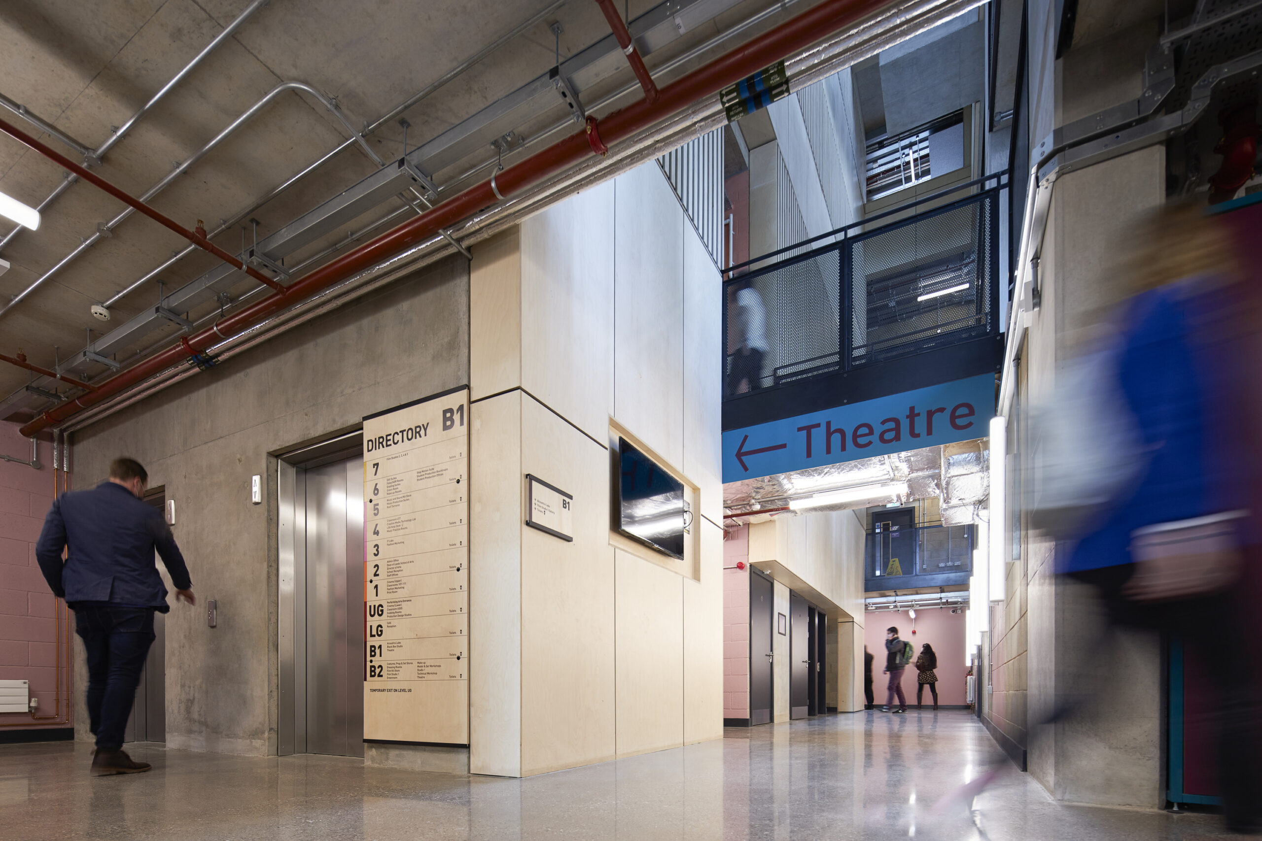 Man pressing a button to enter the lift at Leeds Beckett University School of Art building