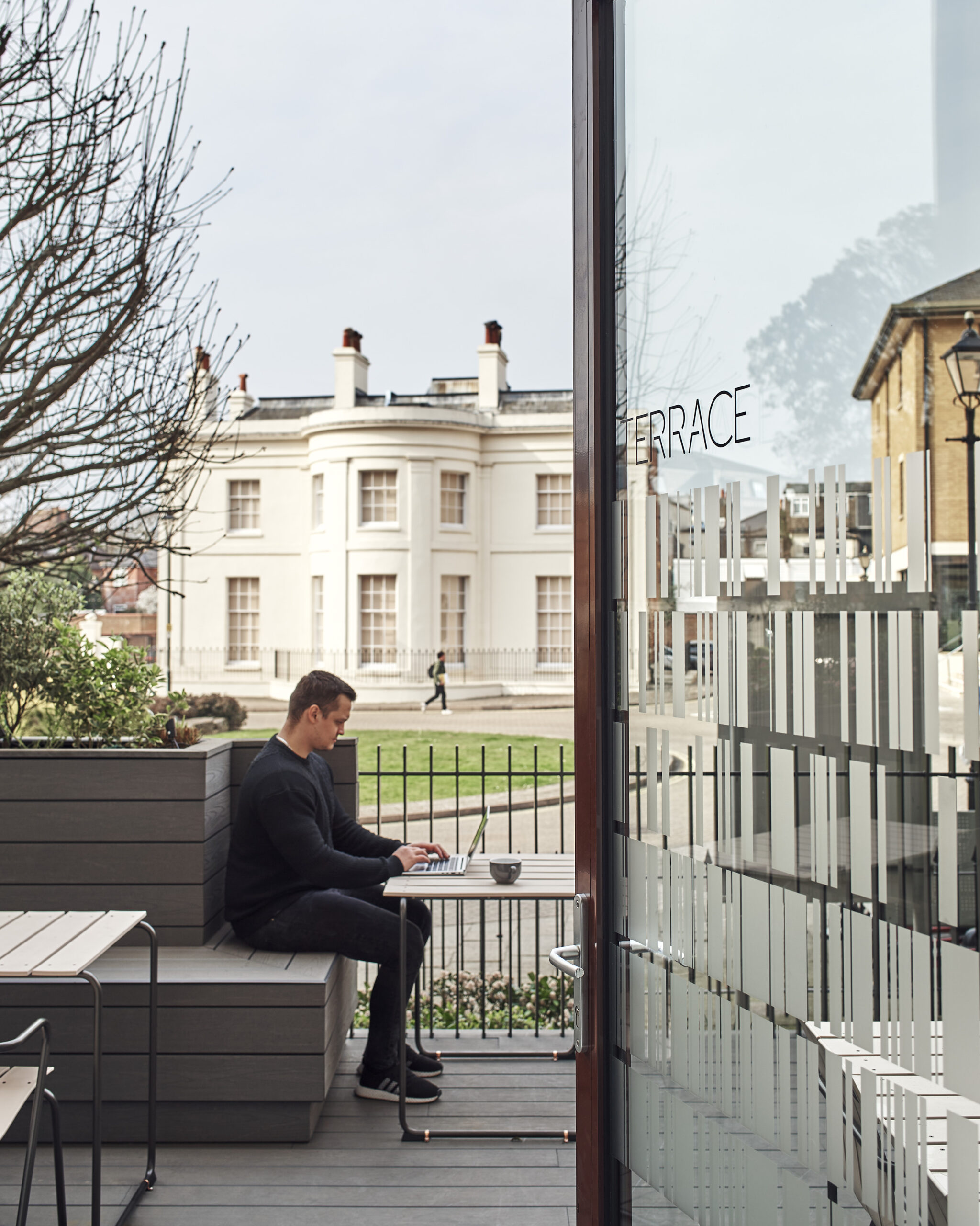 Person working outside on the terrace at Mountbatten House Southampton