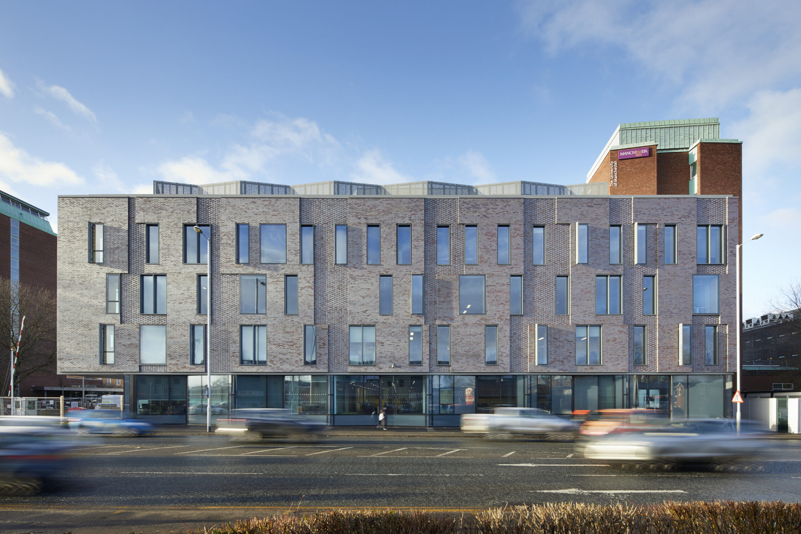 Road view of the University of Manchester Schuster Annexe-Building showing its exterior façade