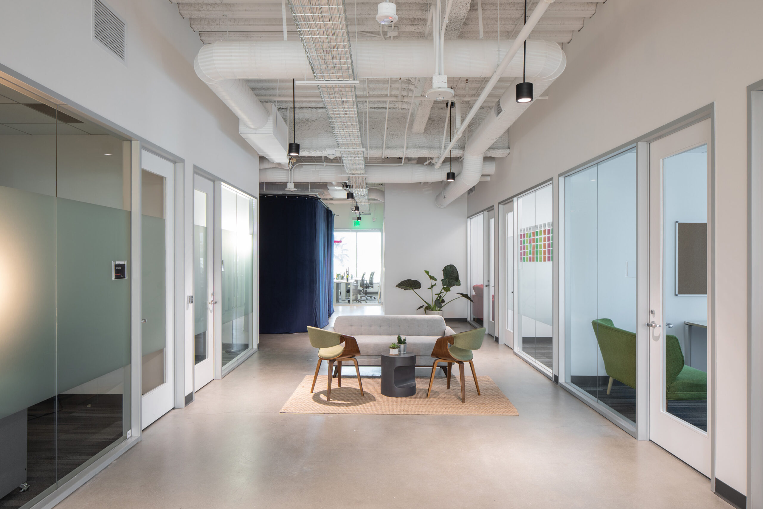 Corridor in-between private meeting rooms at 6060 Center Drive