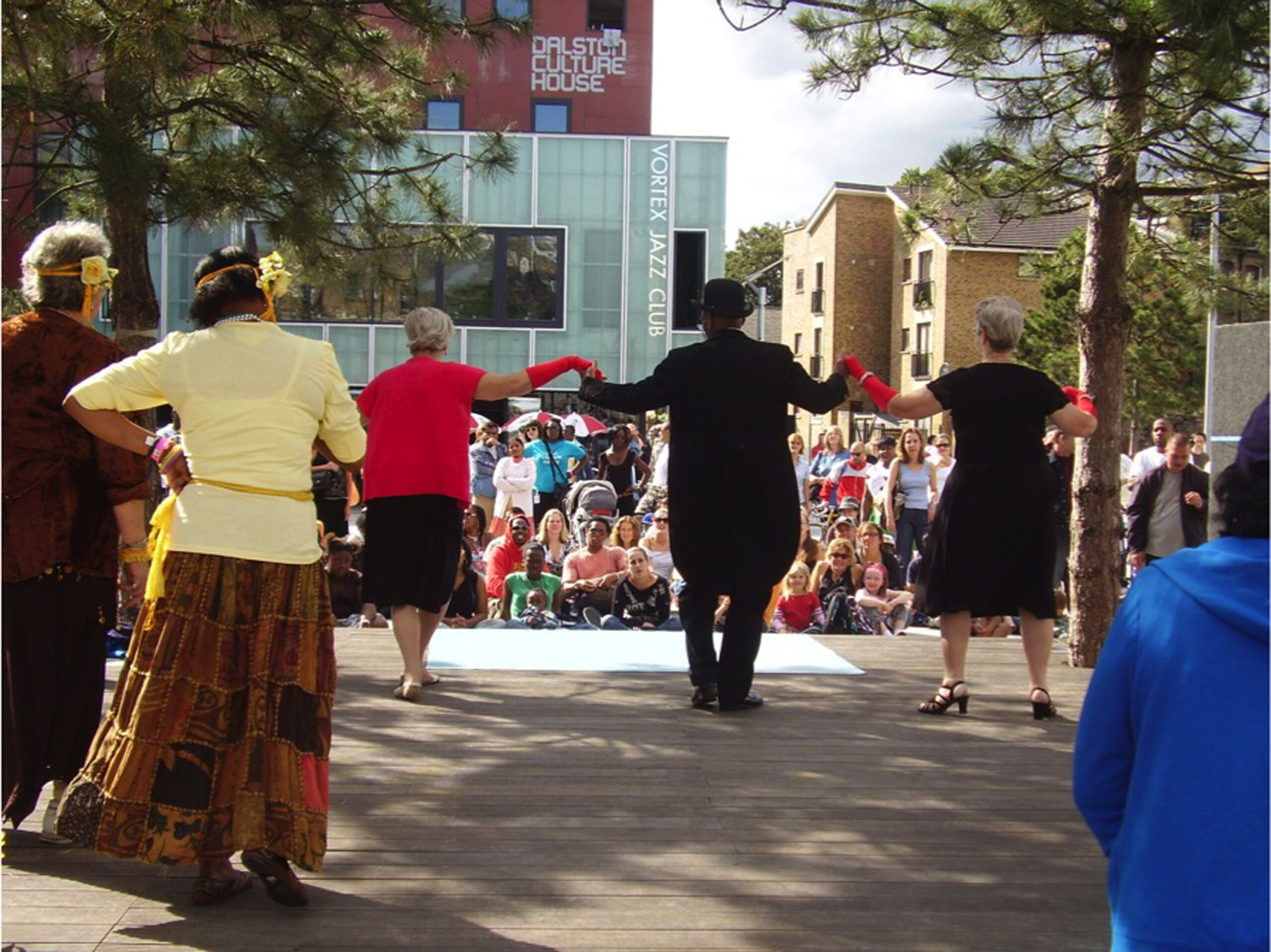 Performers on stage during an event at Gillet Square