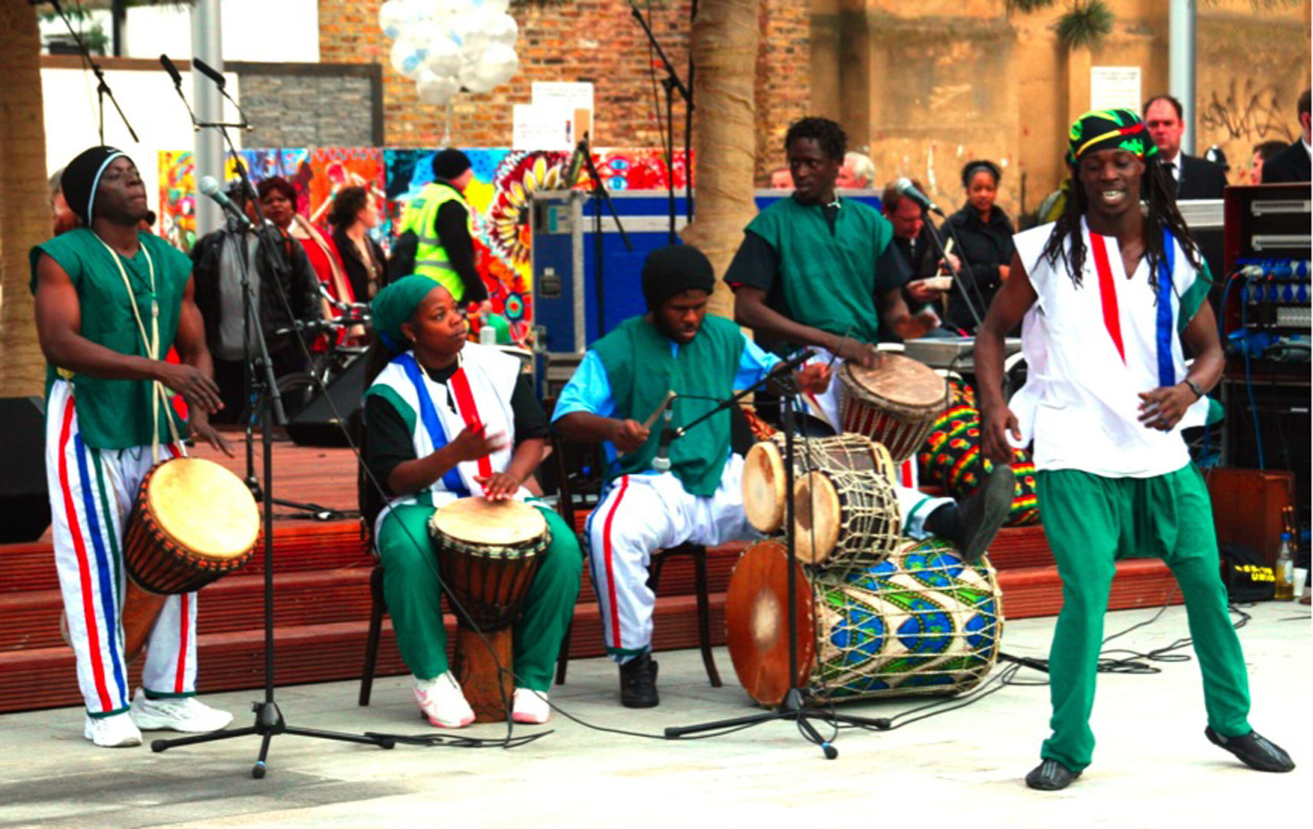 A musical banc playing instruments and performing in Gillett Square