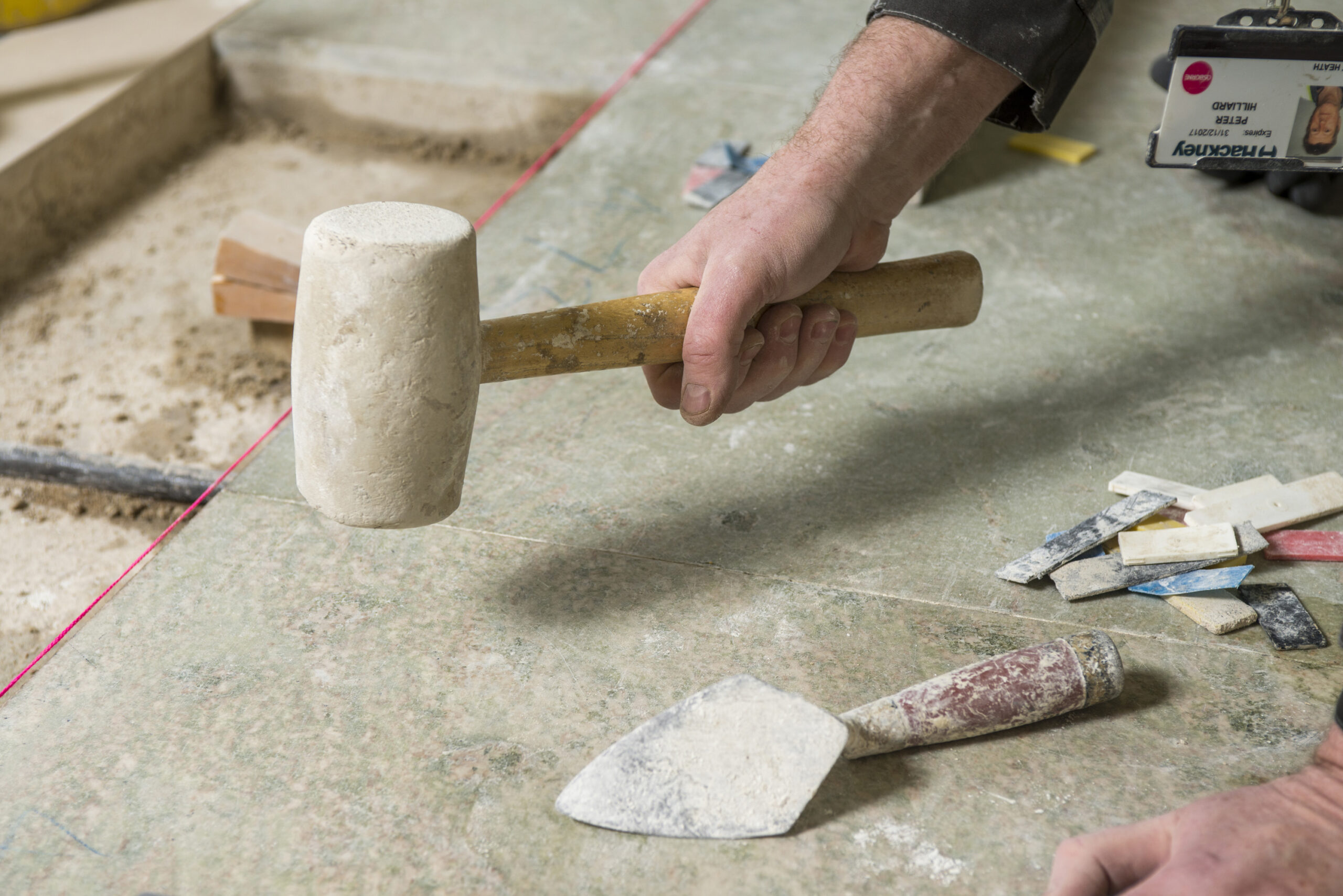 Interior detail shot showing someone holding a hammer