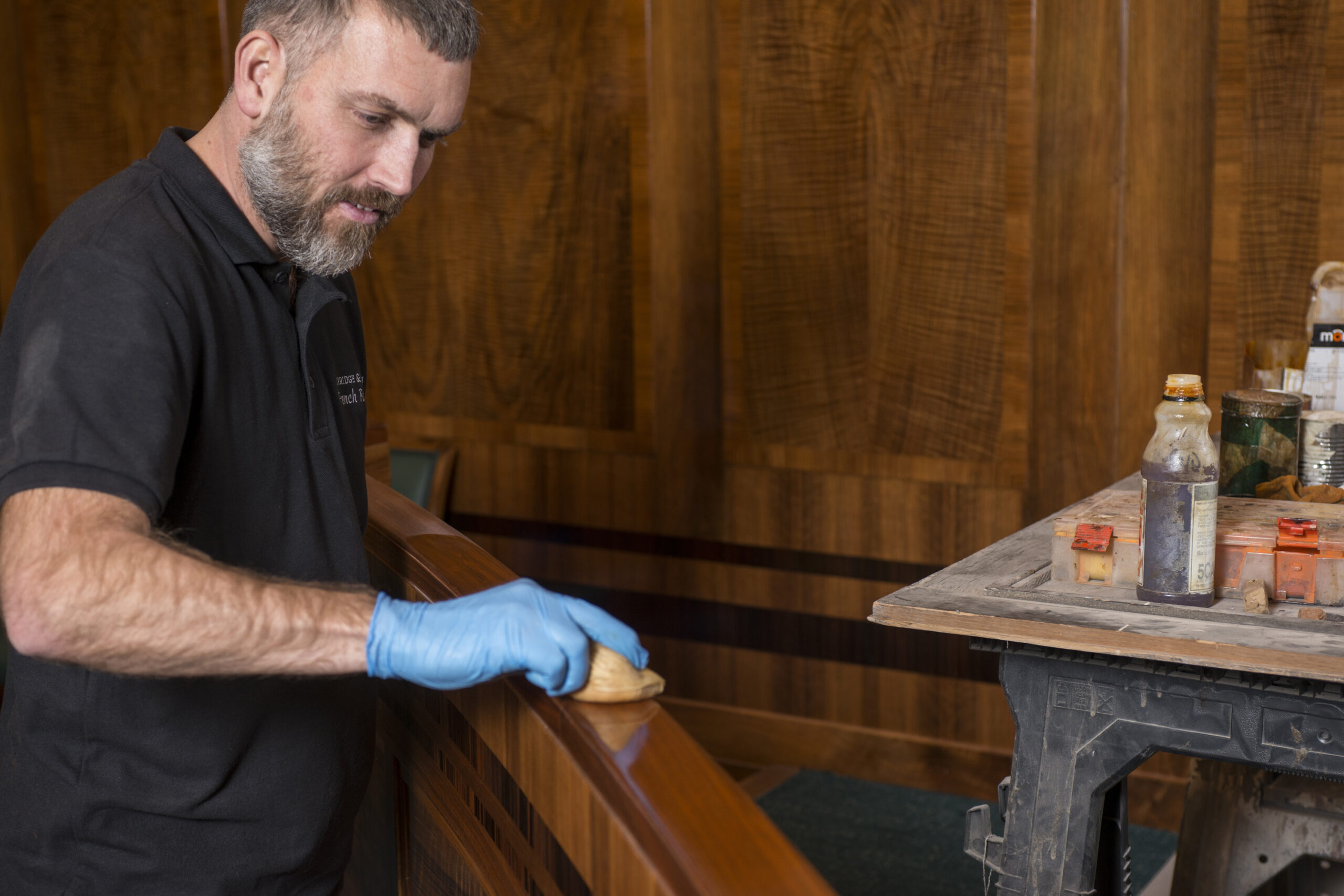 Craftsmen polishing wood for Hackney Town Hall Station