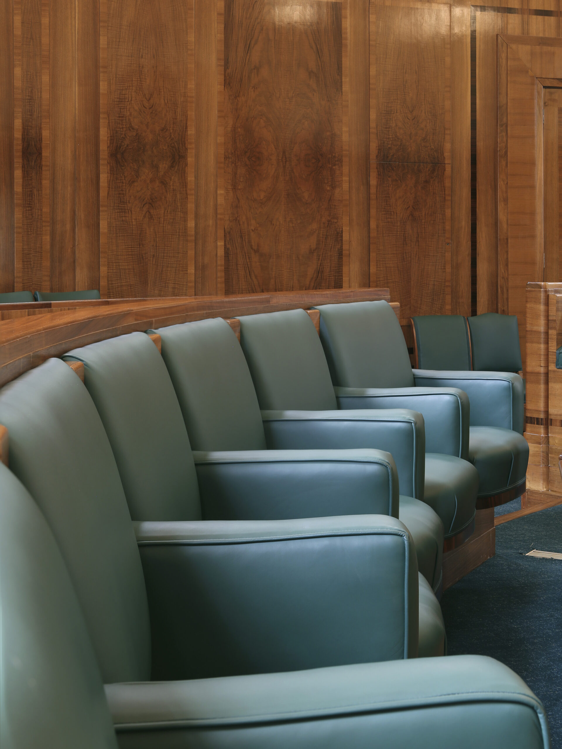 Interior shot of blue seating in the council chamber rooms at Hackney Town Hall