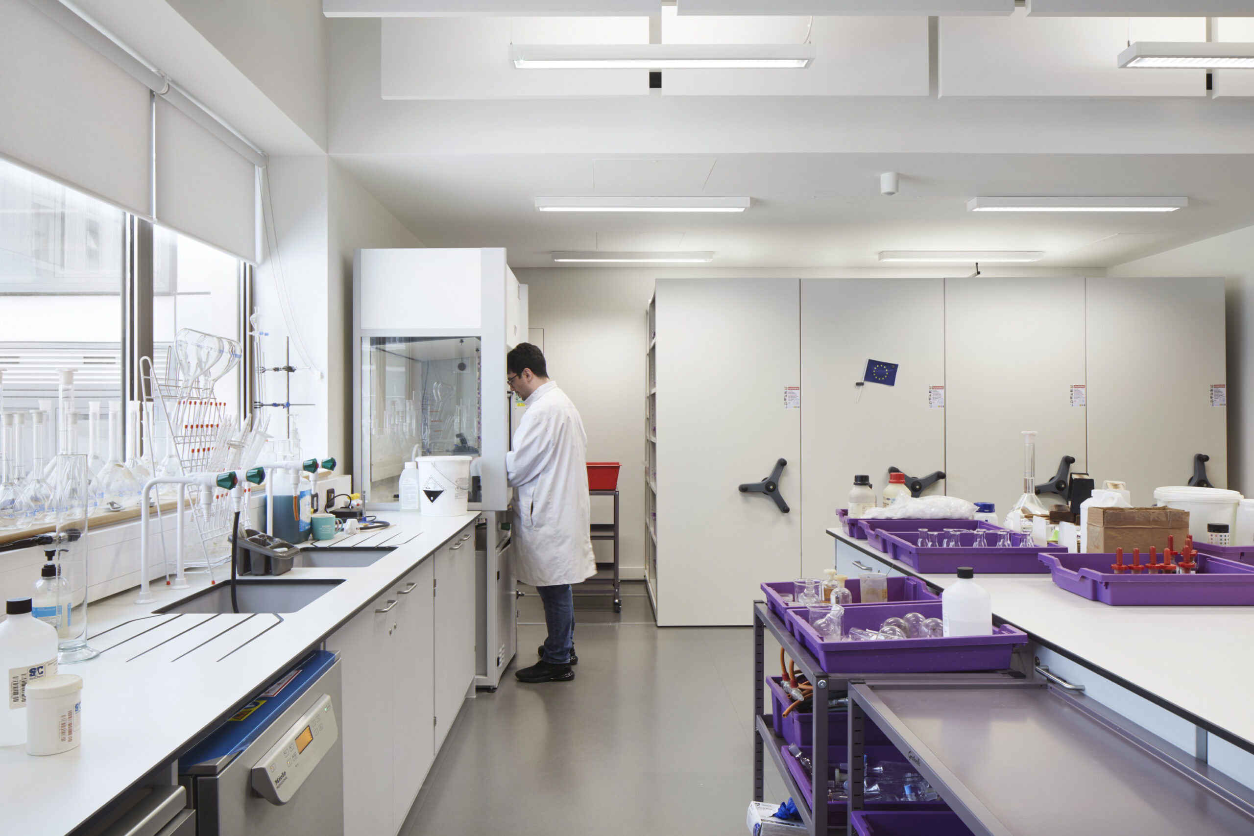 Man wearing a lab coat in laboratory at Central Foundation Boys School