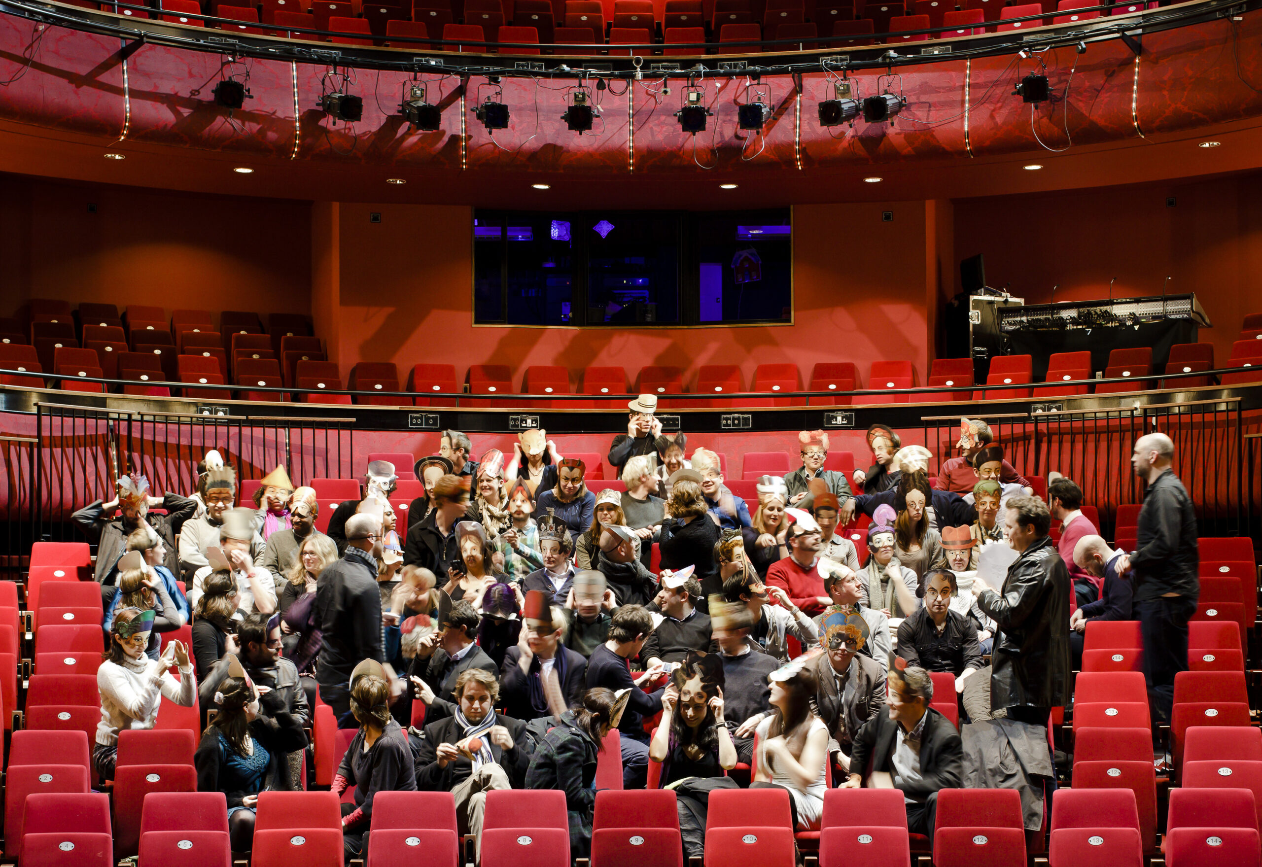 A group of people sat in the theatre at the Corby Cube