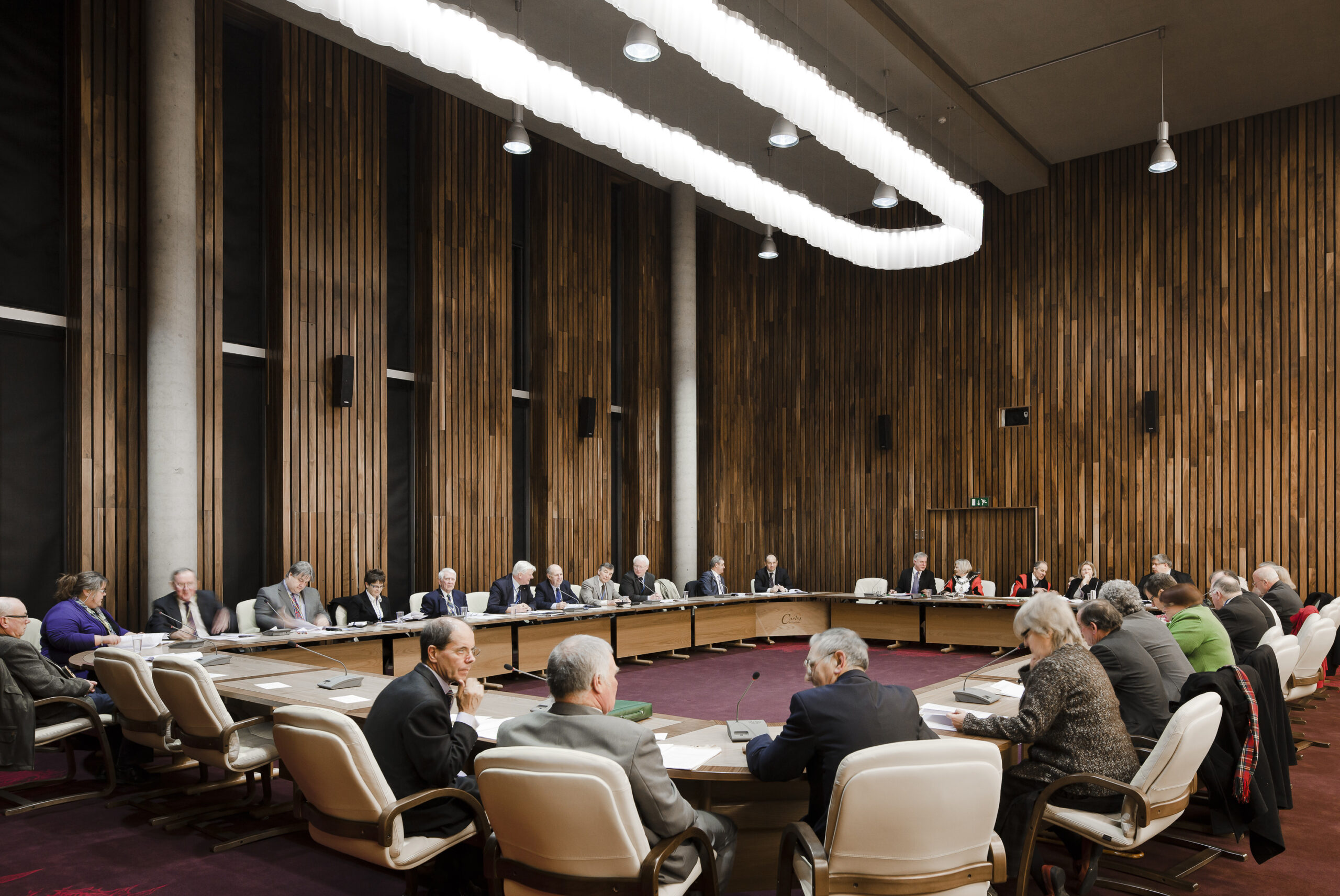 Members of council sitting in a room around a large table