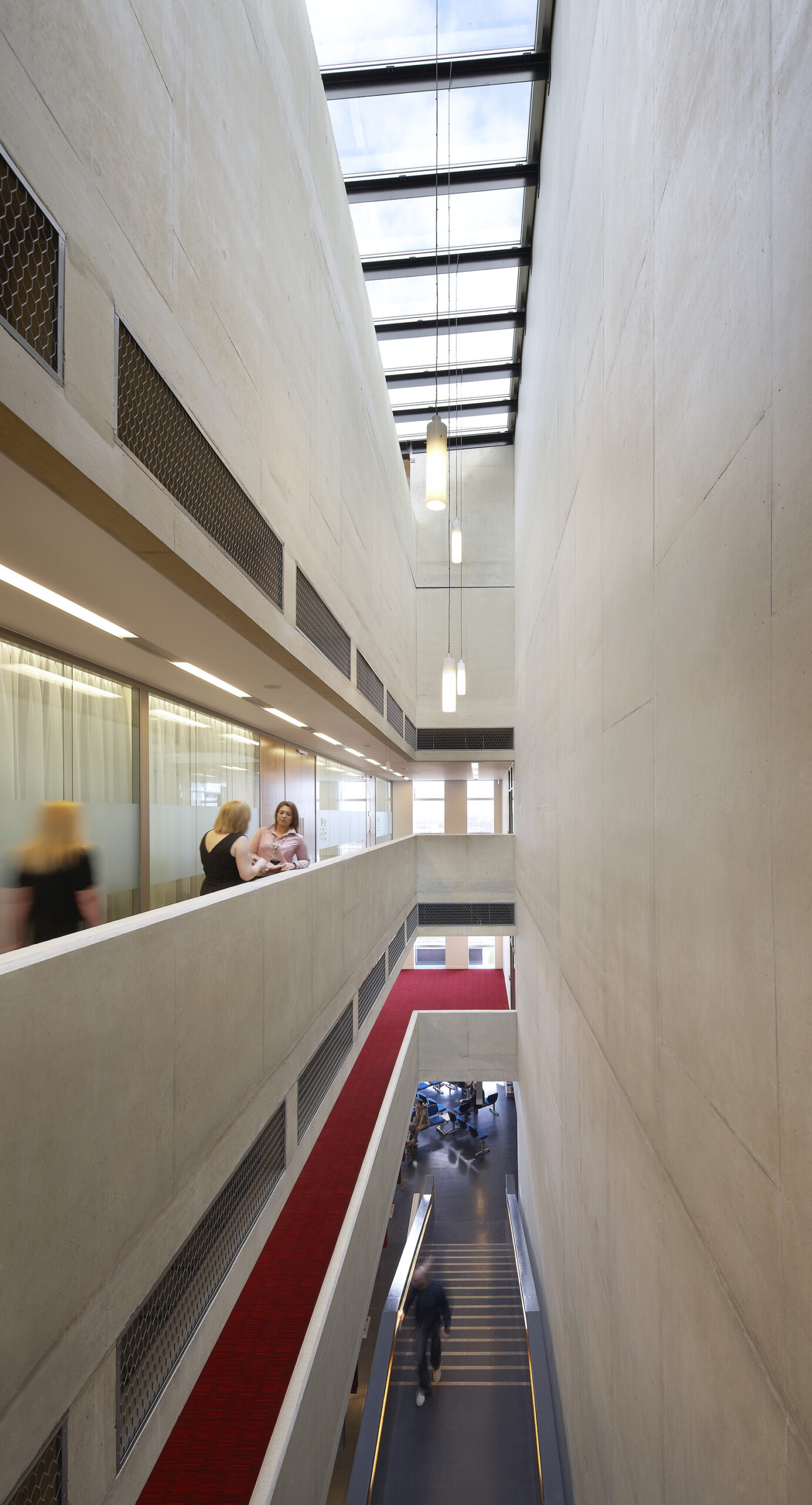 Interior shot of people walking around the building