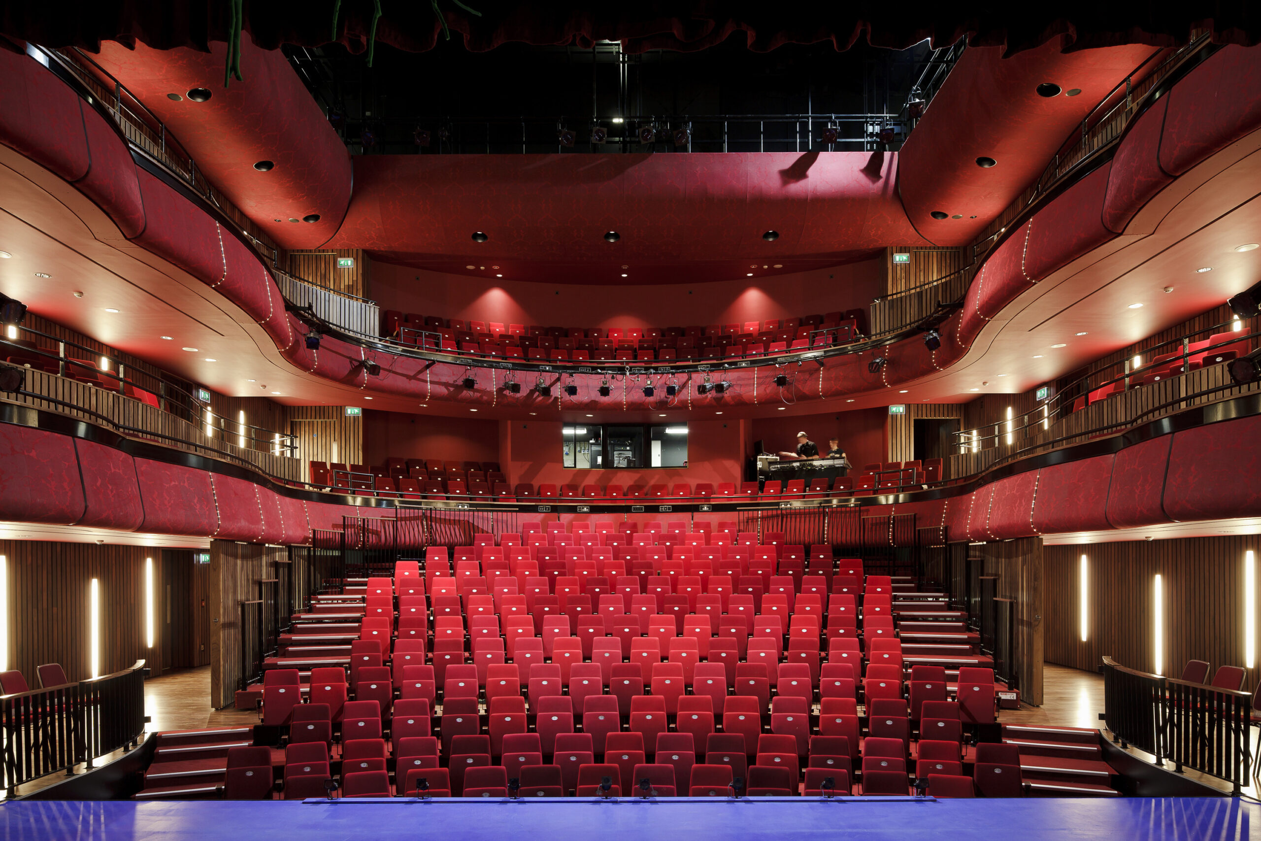 Interior shot of the empty theatre with red seats